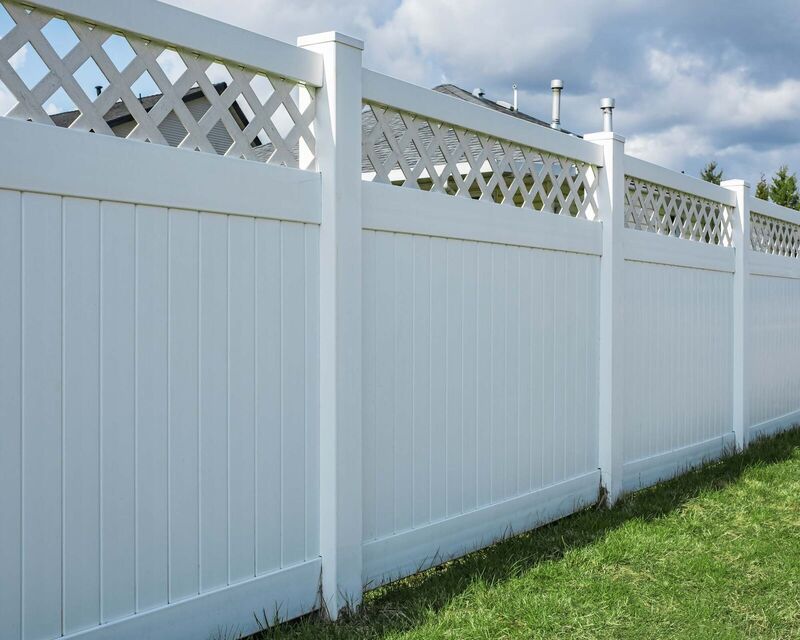 White vinyl privacy fence with a lattice accent top