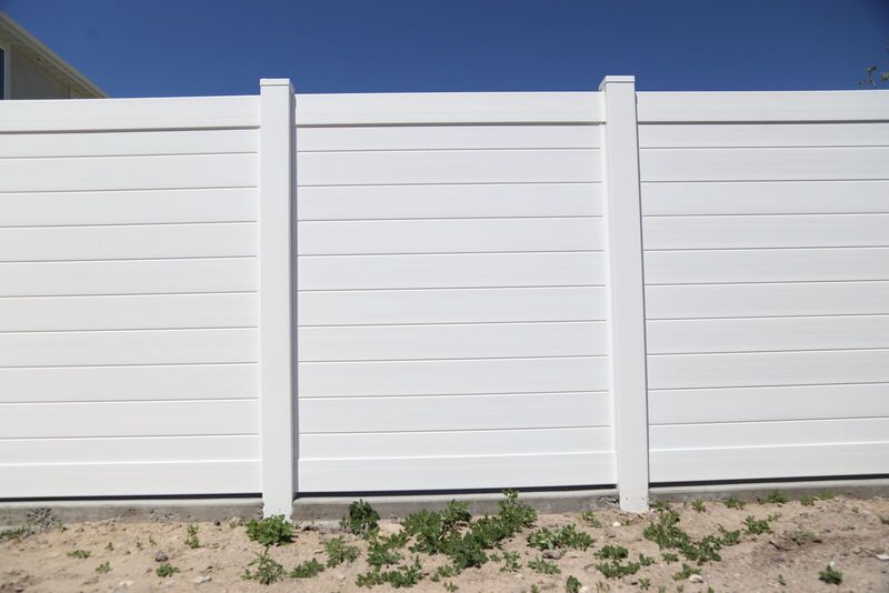 White vinyl privacy fence with horizontal boards