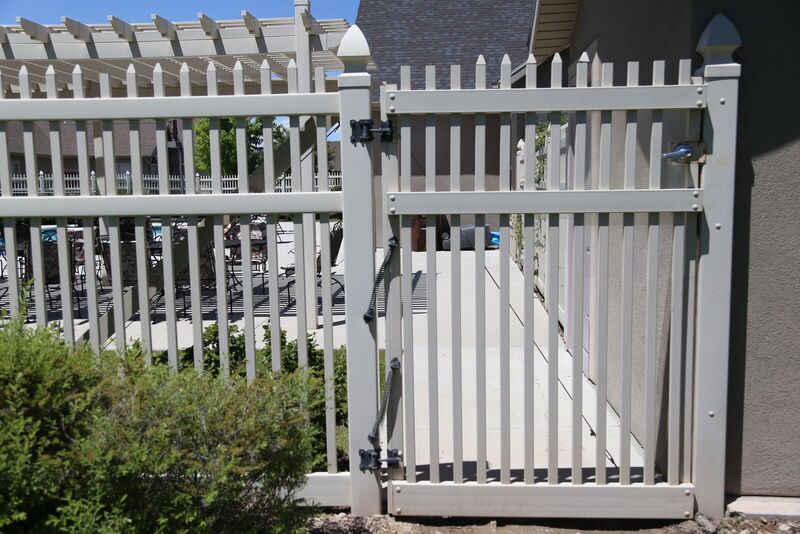 Tan semi-privacy vinyl pool gate with self-closing hardware